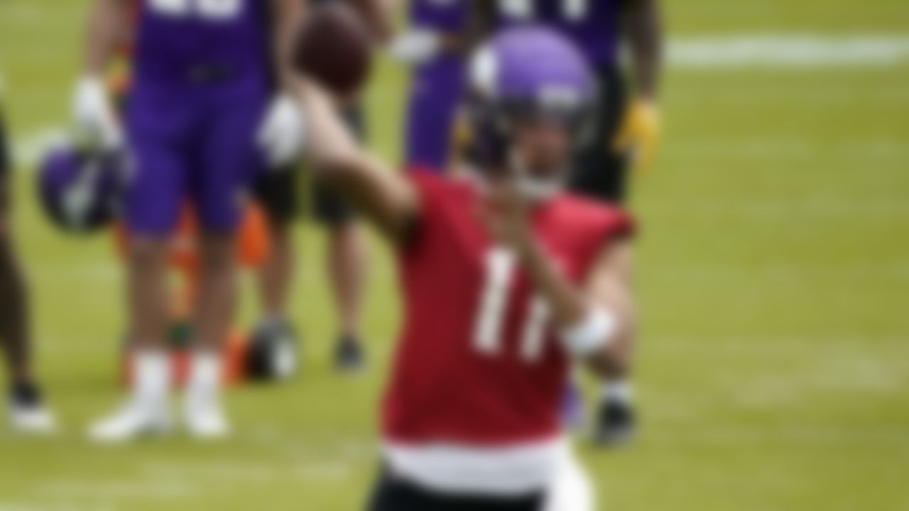 Rookie Minnesota Viking quarterback Kellen Mond throws a pass during NFL football practice in Eagan, Minn., Wednesday, June 2, 2021.