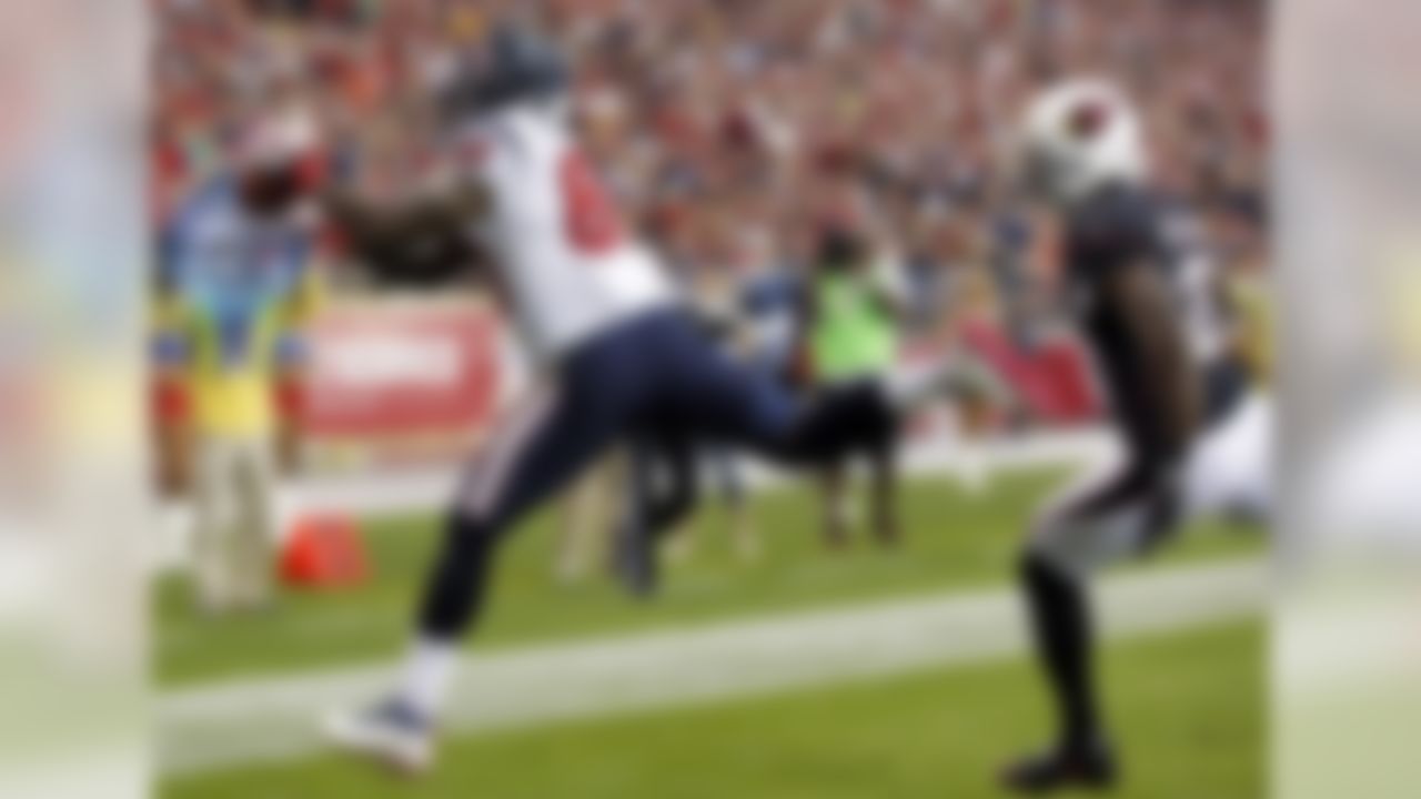 Houston Texans wide receiver Andre Johnson, left, makes a touchdown catch as Arizona Cardinals cornerback Patrick Peterson defends during the first half of an NFL football game Sunday, Nov. 10, 2013, in Glendale, Ariz. (AP Photo/Ross D. Franklin)