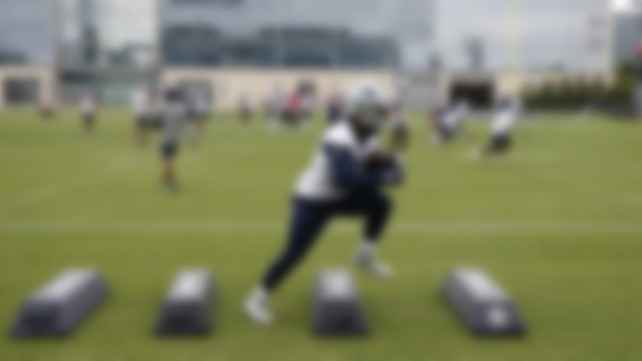 Dallas Cowboys running back Ezekiel Elliott (21) high steps in a drill during an NFL football organized team activity at the team's training facility Tuesday, June 1, 2021 in Frisco, Texas.