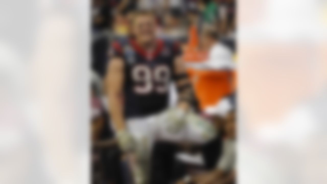 Houston Texans' J.J. Watt stands on the sidelines in the fourth quarter of an NFL football game against the Indianapolis Colts, Sunday, Dec. 16, 2012, in Houston. (AP Photo/Dave Einsel)