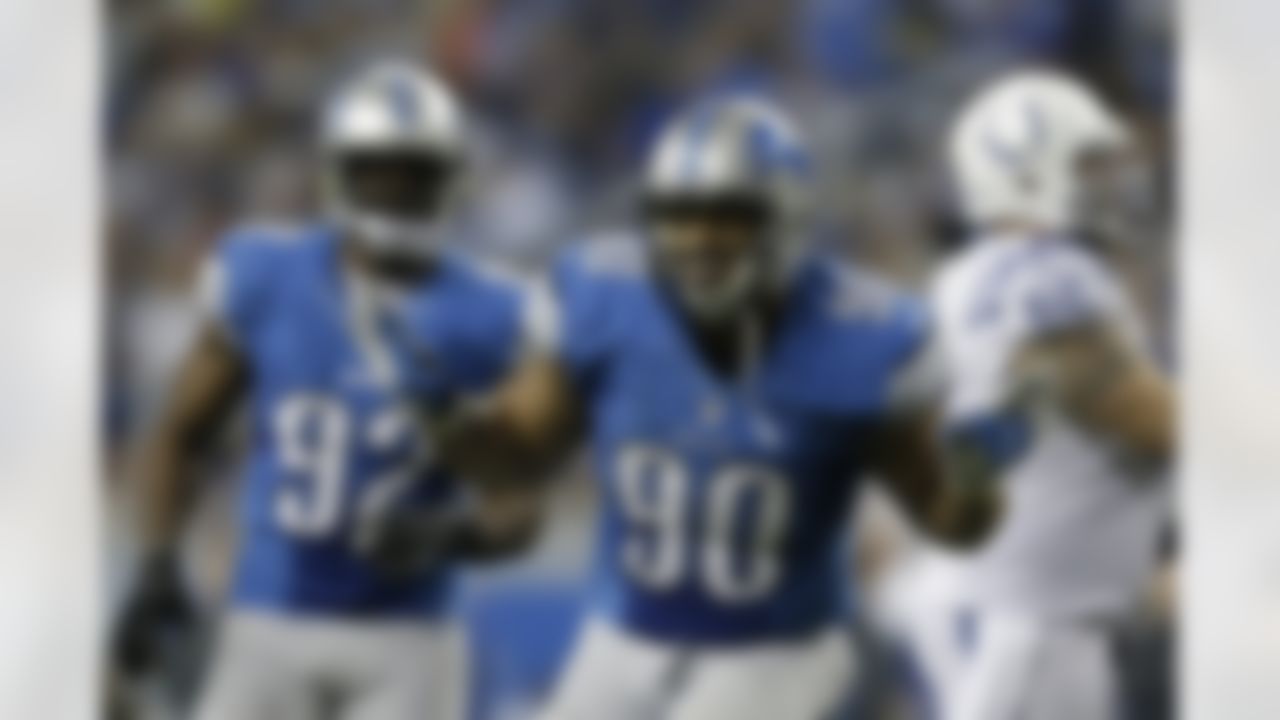 Detroit Lions defensive tackle Ndamukong Suh (90) celebrates pressuring Indianapolis Colts quarterback Andrew Luck in the fourth quarter of an NFL football game in Detroit, Sunday, Nov. 2, 2012. Indianapolis won 35-33. (AP Photo/Paul Sancya)
