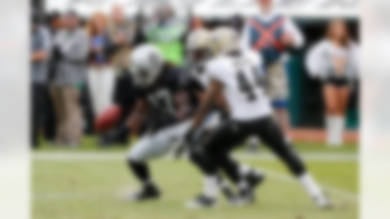 Oakland Raiders wide receiver Denarius Moore (17) drops the pass while being defended by New Orleans Saints defensive back Elbert Mack (44) during the NFL game between the New Orleans Saints and the Oakland Raiders at the O.co Coliseum in Oakland, California on October 18, 2012. (Ric Tapia/NFL)