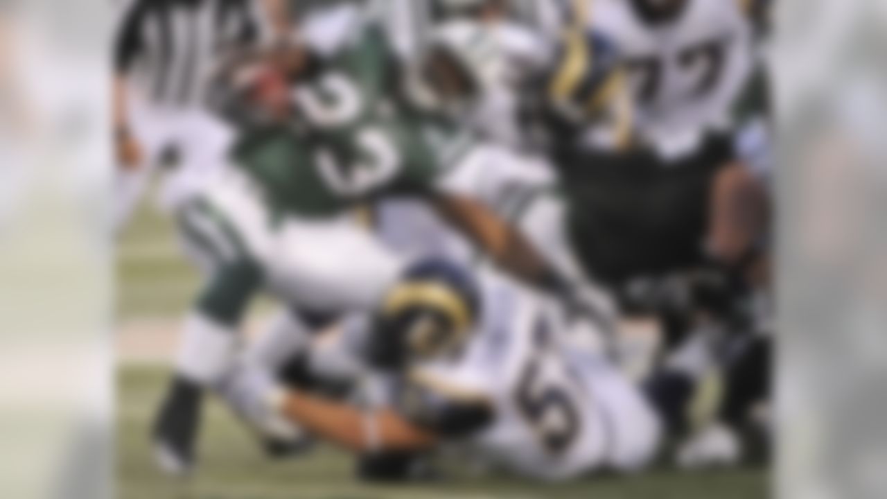 New York Jets running back Shonn Greene (23) is tackled by St. Louis Rams linebacker Chris Chamberlain (57) during the second quarter at Giants Stadium in East Rutherford, N.J., Friday, Aug. 14, 2009. (AP Photo/Bill Kostroun)