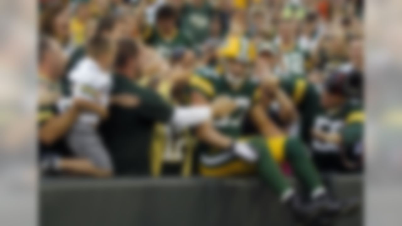 Green Bay Packers wide receiver Jordy Nelson celebrates with fans after catching a touchdown pass during the first half of a preseason NFL football game against the Cleveland Browns Thursday, Aug. 16, 2012, in Green Bay, Wis. (AP Photo/Mike Roemer)