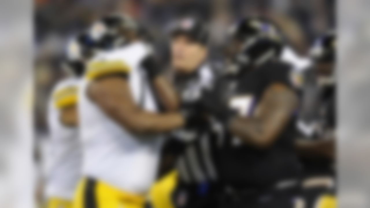 Pittsburgh Steelers tackle Marcus Gilbert, left, and Baltimore Ravens defensive end Arthur Jones get into a scuffle in the first half of an NFL football game, Thursday, Nov. 28, 2013, in Baltimore. (AP Photo/Nick Wass)