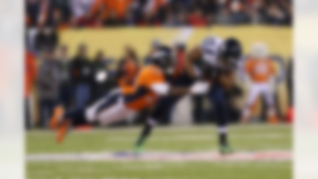 Seattle Seahawks wide receiver Doug Baldwin (89) is tackled by Denver Broncos cornerback Champ Bailey (24) during Super Bowl XLVIII at Metlife Stadium on Sunday, Feb. 2, 2014, in East Rutherford, N.J. (Ben Liebenberg/NFL)