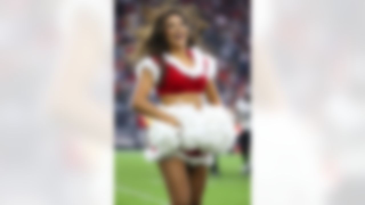 Houston Texans cheerleaders cheer during an NFL football game between the Baltimore Ravens and the Houston Texans, Sunday Dec. 21, 2014, in Houston, TX. (AP Photo/Tom Hauck)