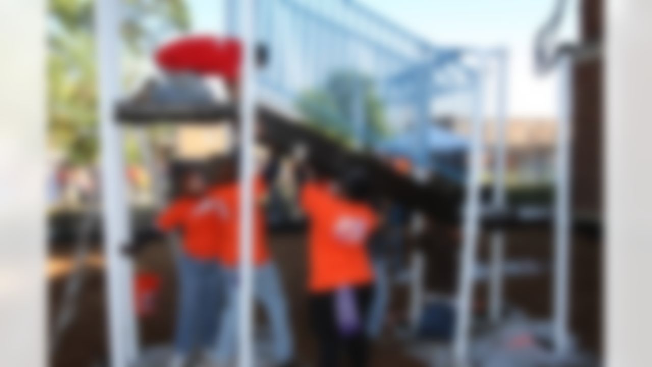 The Home Depot associates place together a piece of the new playground. (Photo by Tom Copeland/Home Depot)