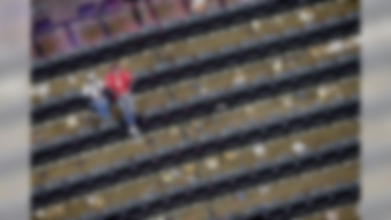 Atlanta Falcons fans sit in the bleachers after  the second half of an NFL football game against the New Orleans Saints, Sunday, Jan. 3, 2016, in Atlanta. The New Orleans Saints won 20-17. (AP Photo/John Bazemore)