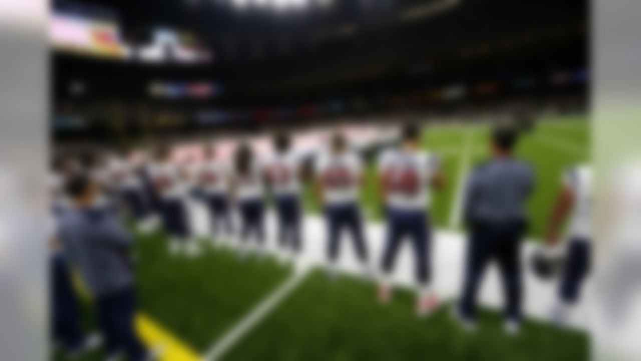 Houston Texans players stand at attention for the national anthem before the start of a preseason NFL football game against the New Orleans Saints in New Orleans, Saturday, Aug. 26, 2017. (AP Photo/Butch Dill)