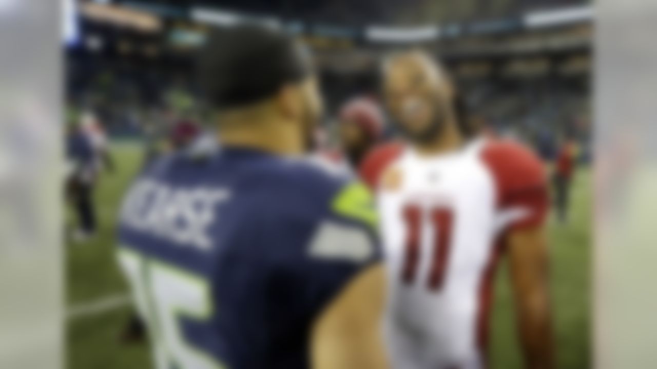 Arizona Cardinals wide receiver Larry Fitzgerald (11) laughs as he talks with Seattle Seahawks wide receiver Jermaine Kearse after an NFL football game, Saturday, Dec. 24, 2016, in Seattle. (AP Photo/Ted S. Warren)