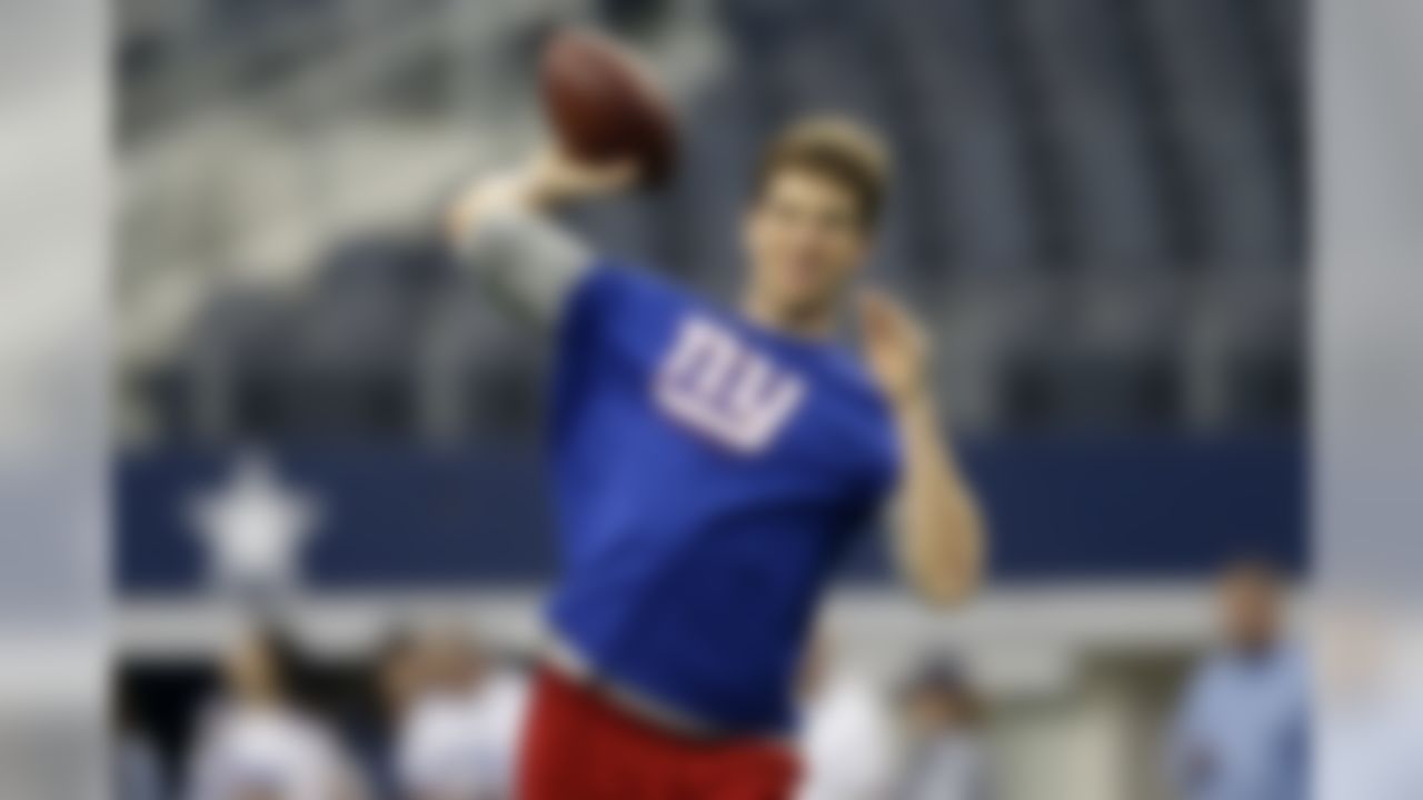 New York Giants quarterback Eli Manning warms up before an NFL football game against the Dallas Cowboys, Sunday, Oct., 19, 2014, in Arlington, Texas. (AP Photo/LM Otero)