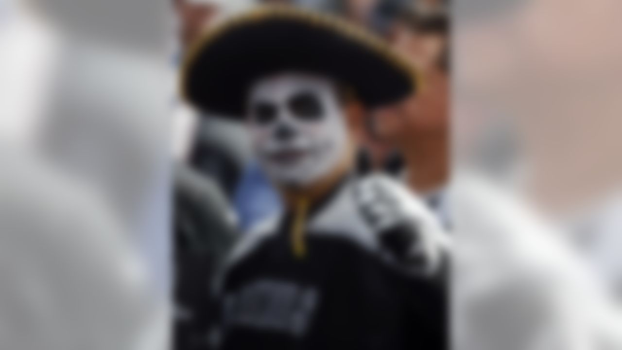 An Oakland Raiders fan gestures before an NFL football game against the New England Patriots, Sunday, Nov. 19, 2017, in Mexico City. (AP Photo/Eduardo Verdugo)