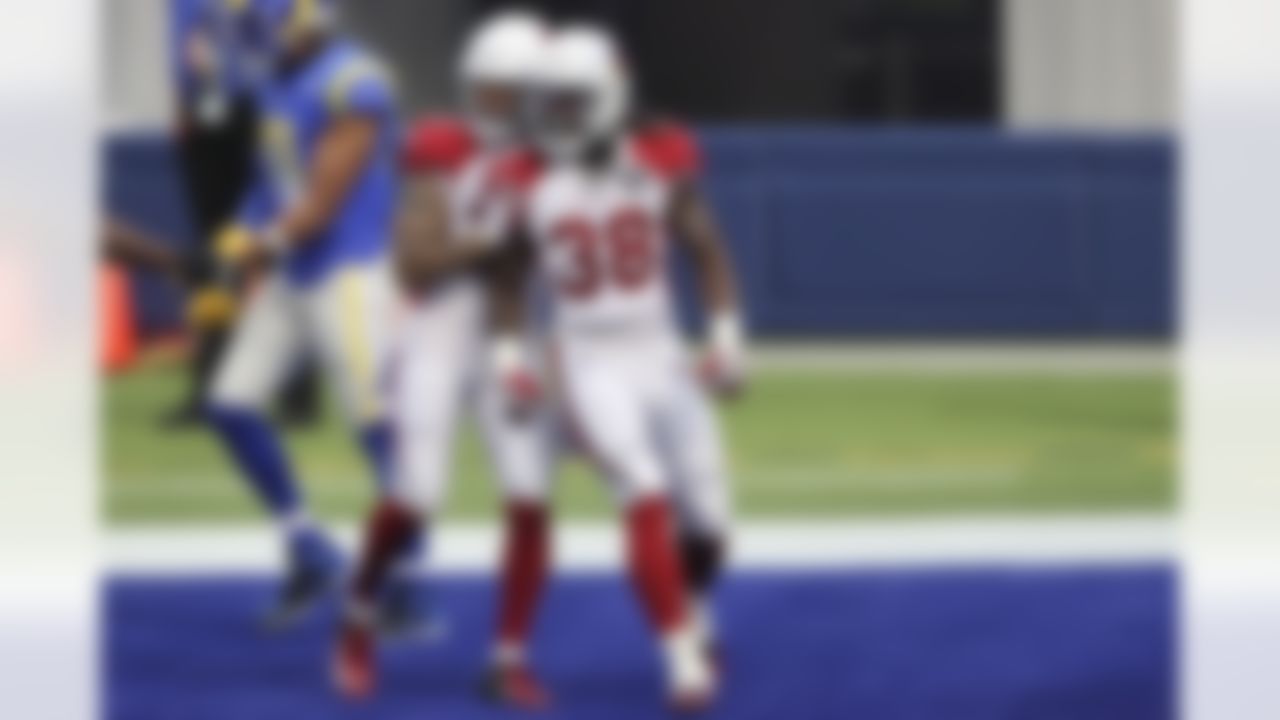 Arizona Cardinals running back Jonathan Ward (38) celebrates after a touchdown with running back D.J. Foster (37) during an NFL football game against the Los Angeles Rams on Sunday, January 3, 2021 in Inglewood, California.