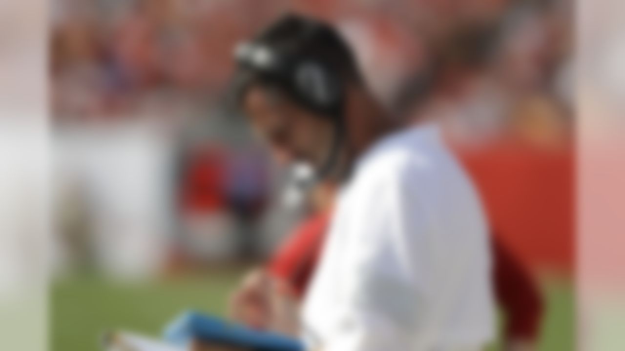 San Francisco 49ers head coach Kyle Shanahan reads on the sidelines against the Tampa Bay Buccaneers during the first half an NFL football game, Sunday, Sept. 8, 2019, in Tampa, Fla. (AP Photo/Chris O'Meara)