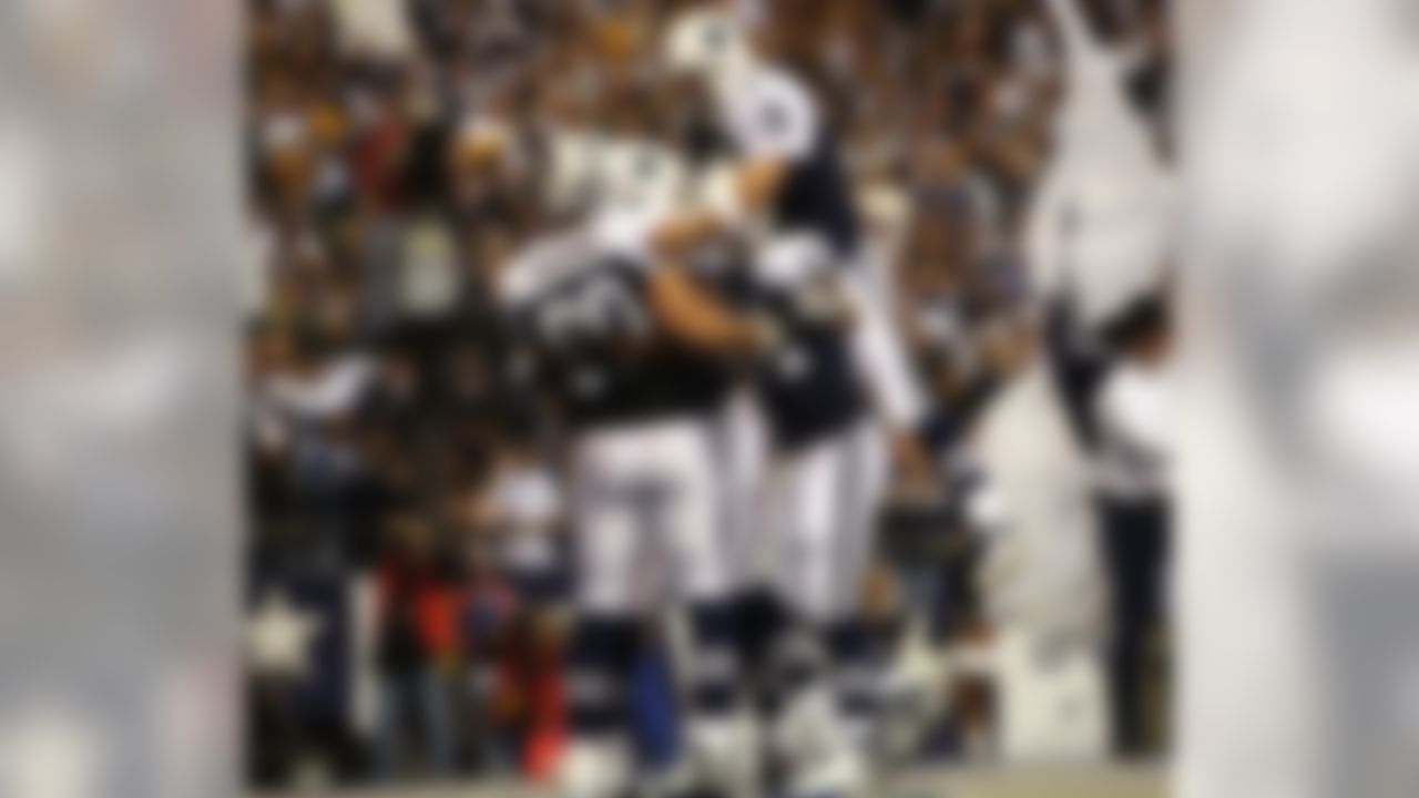 Dallas Cowboys wide receiver Terrell Owens #81 is congratulated by his teammates after scoring a second quarter touchdown against the Green Bay Packers at Texas Stadium in Irving, TX on November 29, 2007. Photo by Jeff Lewis / Sharp Shot.