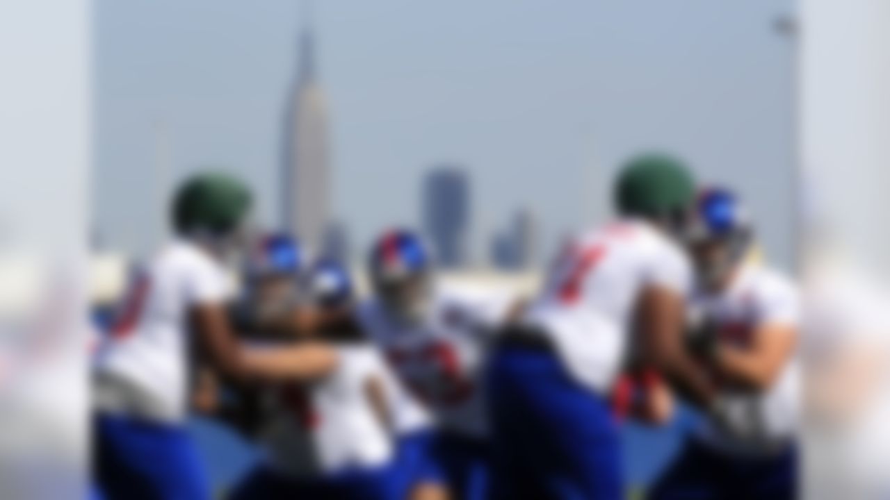 New York Giants players participate in a drill during NFL football rookie minicamp in East Rutherford, N.J., Friday, May 11, 2012. (AP Photo/Mel Evans)