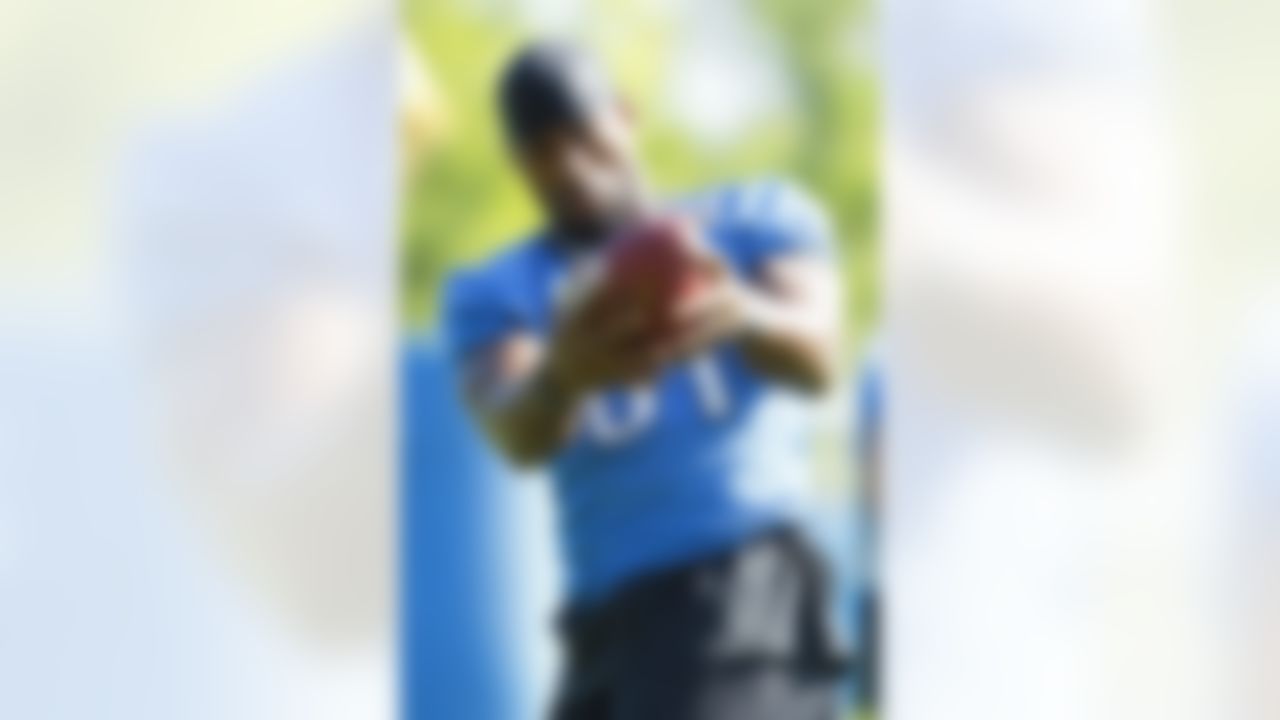 Detroit Lions wide receiver Calvin Johnson (81) makes a catch during NFL football training camp at the team's practice facility in Allen Park, Mich., Saturday, July 30, 2011. (AP Photo/Rick Osentoski)