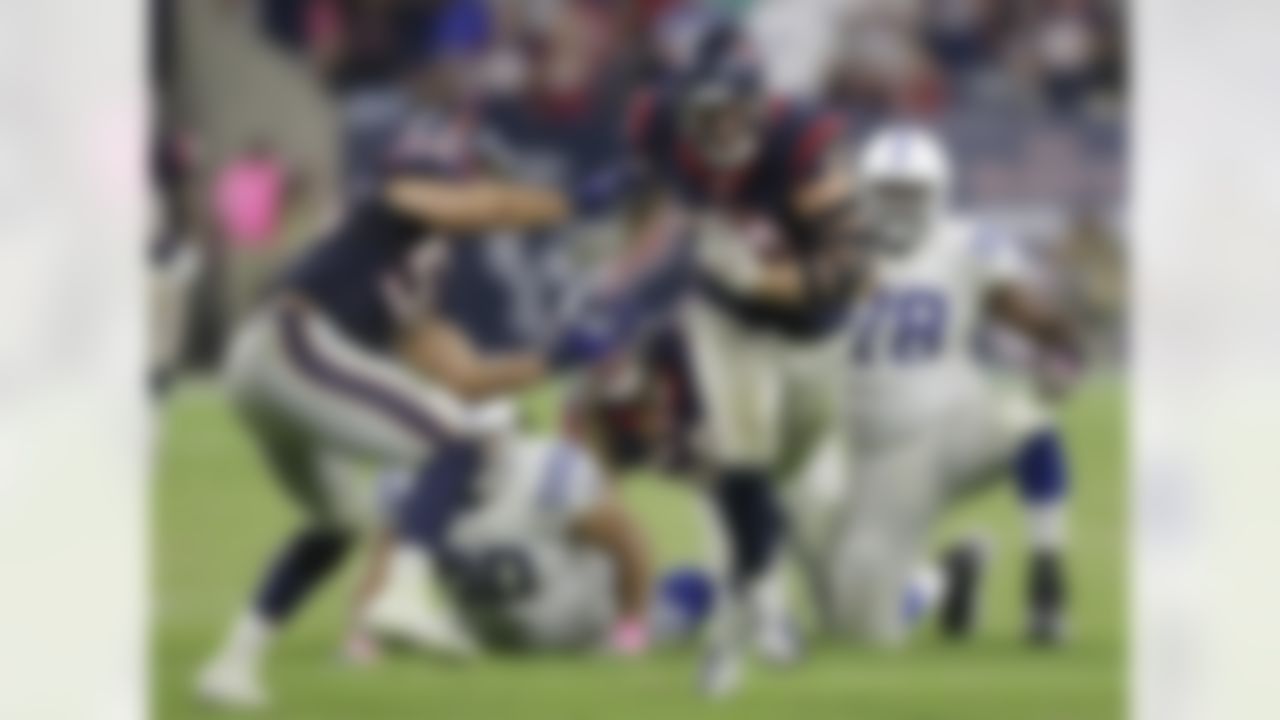 FILE - In this Oct. 9, 2014, file photo, Houston Texans' J.J. Watt (99) returns a fumble for a touchdown against the Indianapolis Colts during the second half of an NFL football game in Houston. The defensive end pretty much has provided enough fodder to fill any list of memorable plays this season, from top to bottom. (AP Photo/Patric Schneider, File)