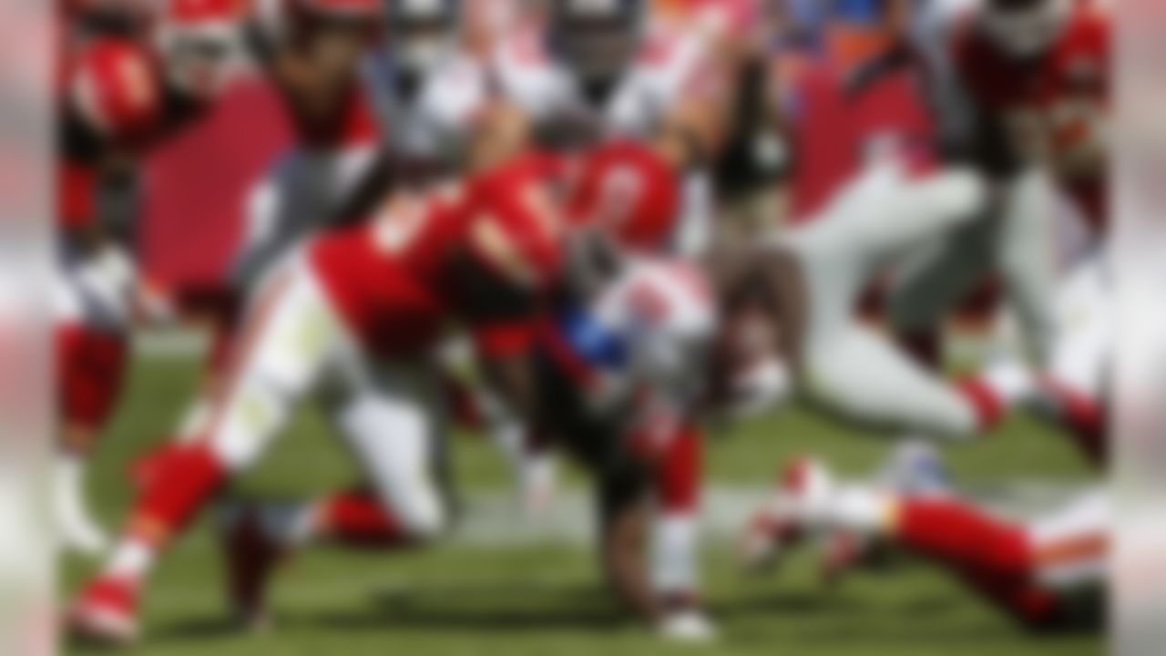 New York Giants running back David Wilson (22) is tackled by Kansas City Chiefs inside linebacker Akeem Jordan (55) during the first half of an NFL football game at Arrowhead Stadium in Kansas City, Mo., Sunday, Sept. 29, 2013. (AP Photo/Ed Zurga)