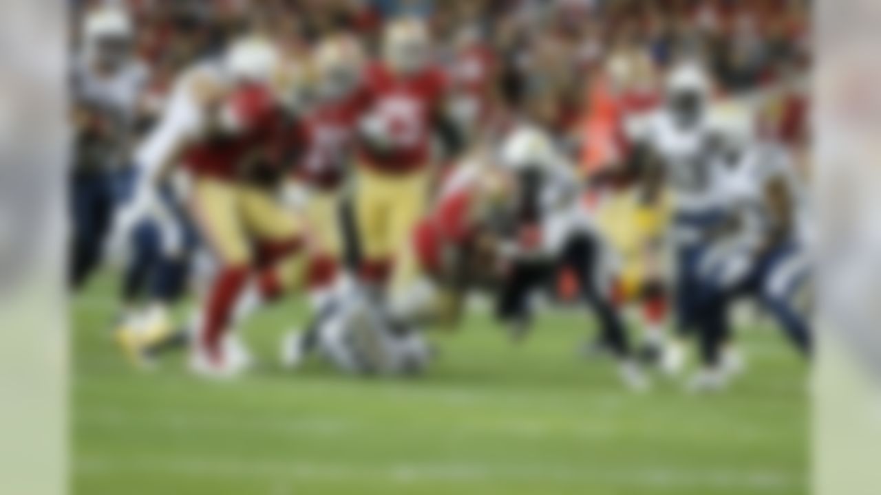 San Francisco 49ers running back Frank Gore (21) runs against San Diego Chargers free safety Eric Weddle (32) during an NFL football game between the San Diego Chargers and the San Francisco 49ers in Santa Clara, Calif. at Levi Stadium, Saturday, Dec. 20, 2014. (Ric Tapia/NFL)