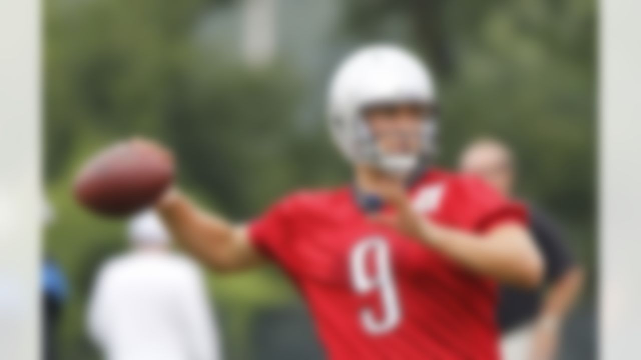 Detroit Lions quarterback Matthew Stafford (9) throws during the opening day of the Lions NFL football training camp at their training facility in Allen Park, Mich., Saturday, July 31, 2010. (AP Photo/Carlos Osorio)