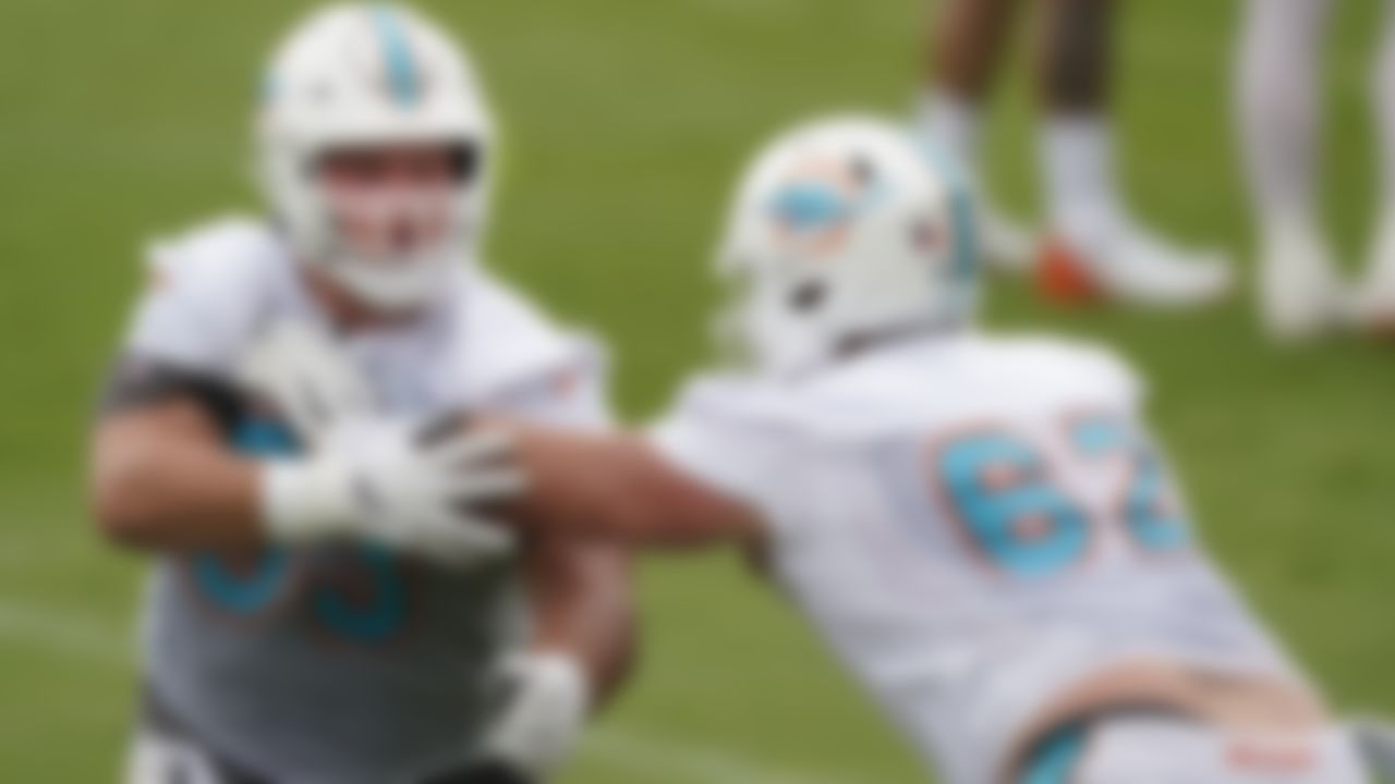 Miami Dolphins centers Michael Deiter, left, and Matt Skura run a drill during a mandatory minicamp at the NFL football team's training camp, Wednesday, June 16, 2021, in Davie, Fla.