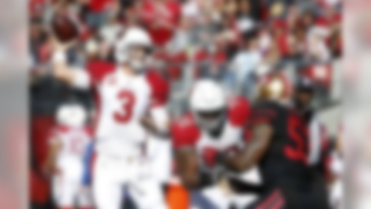 Arizona Cardinals quarterback Carson Palmer (3) looks to pass as tackle Bobby Massie (70) blocks San Francisco 49ers linebacker NaVorro Bowman (53) during the first half of an NFL football game in Santa Clara, Calif., Sunday, Nov. 29, 2015. (AP Photo/Tony Avelar)