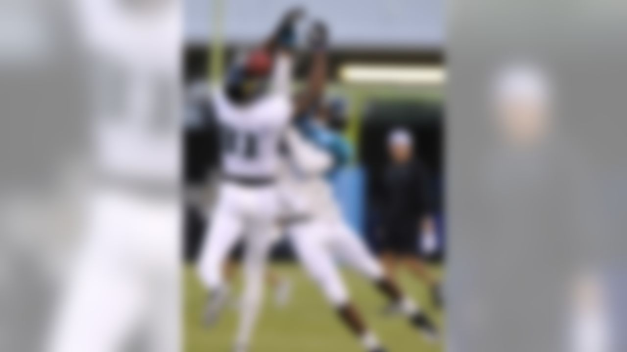 Jacksonville Jaguars rookie cornerback T.J. Heath (34), right, breaks up a pass intended for receiver Kassim Osgood (81) during NFL football training camp Sunday, July 31, 2011, in Jacksonville, Fla. (AP Photo/Rick Wilson)