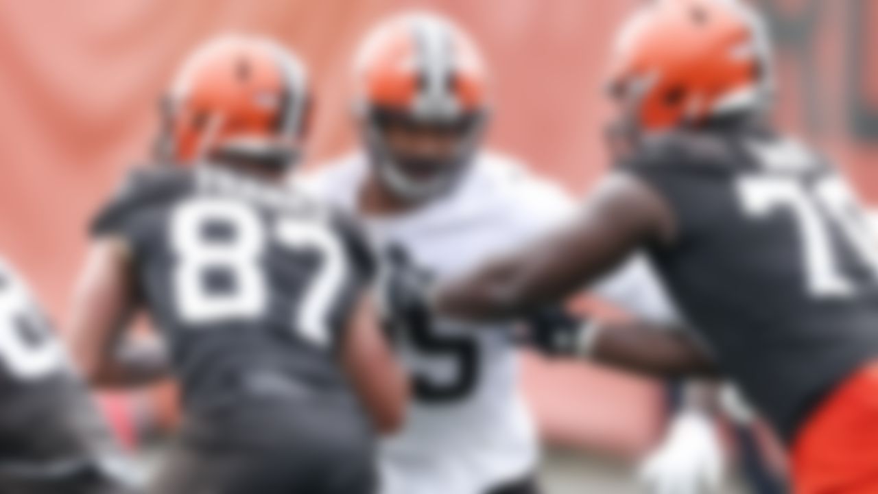 Cleveland Browns defensive end Myles Garrett, center, works against Jordan Franks (87) and Greg Senat (70) during an NFL football practice at the team's training facility Wednesday, June 2, 2021, in Berea, Ohio.