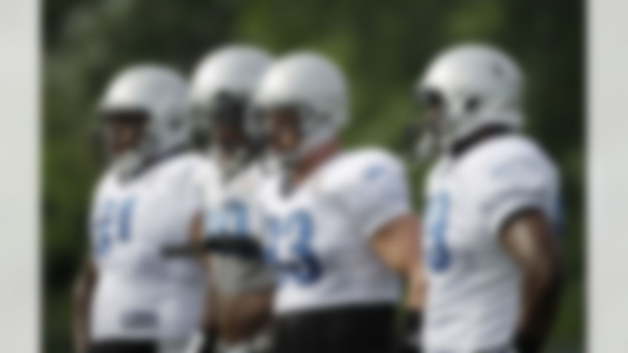 Detroit Lions defensive linemen from left, Robert Callaway, Willie Young, Kyle Vanden Bosch and Narada Williams stand during a break in NFL football training camp in Allen Park, Mich., Tuesday, Aug. 2, 2011. (AP Photo/Carlos Osorio)