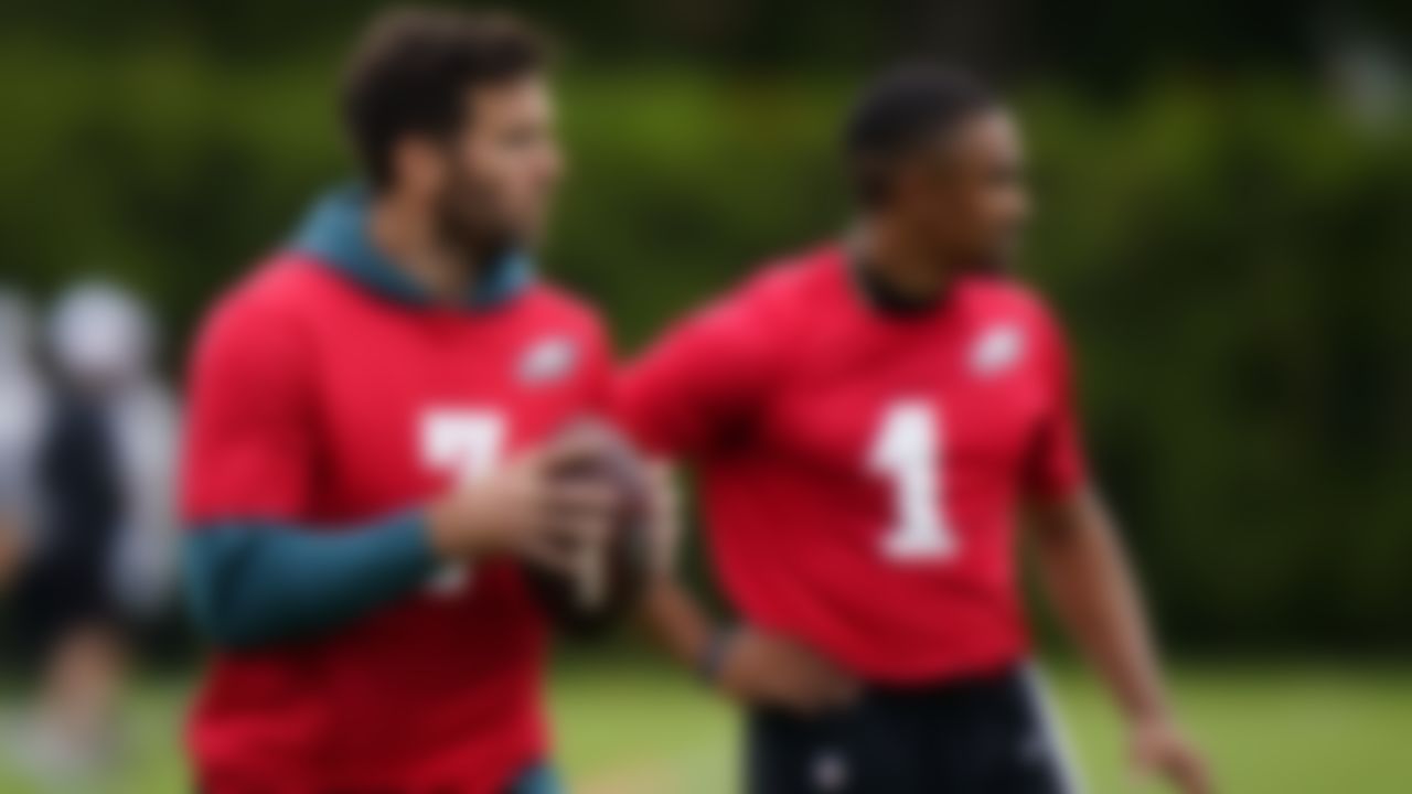 Philadelphia Eagles' Joe Flacco, left, participates in a drill as Jalen Hurts looks on during organized team activities at the NFL football team's training facility, Tuesday, May 25, 2021, in Philadelphia.
