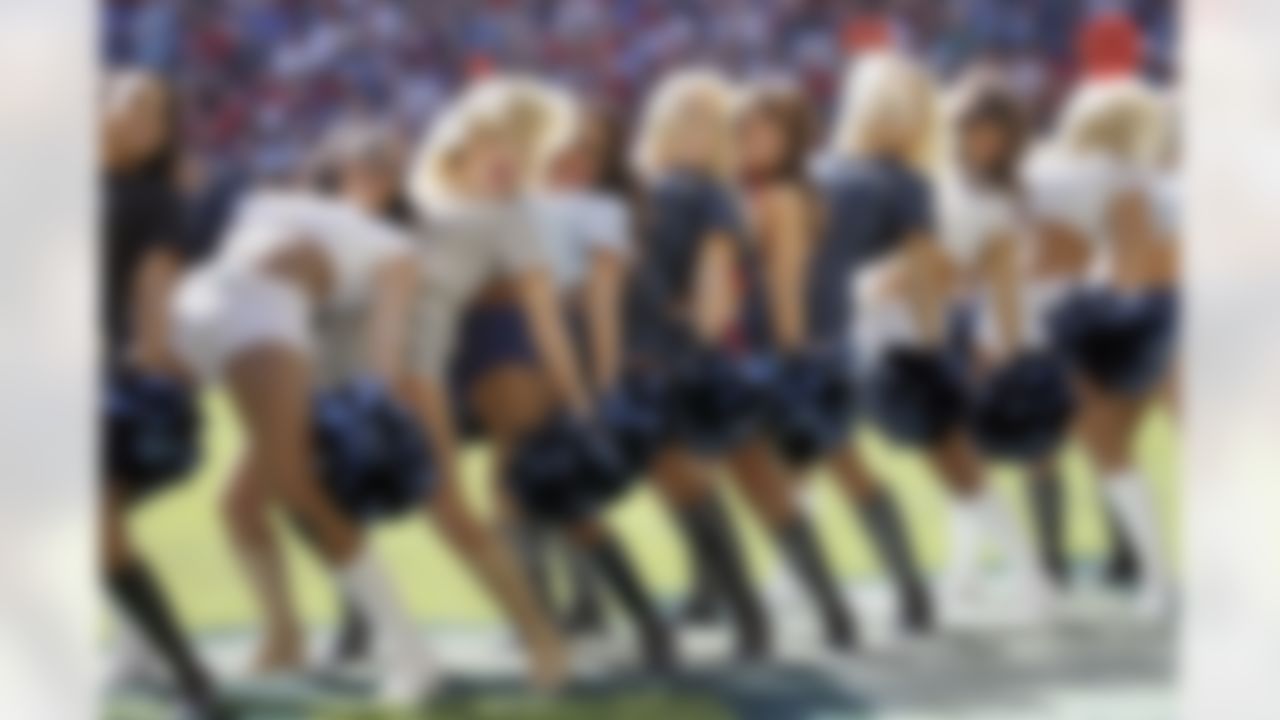 Houston Texans cheerleaders wear military themed outfits to honor U.S. Armed Forces for Salute to Service Day during a NFL week twelve football game against the Cincinnati Bengals on Sunday, Nov. 23, 2014 in Houston. (AP Photo/G. Newman Lowrance)