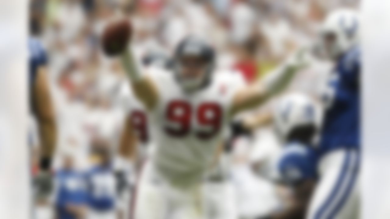 Houston Texans rookie defensive end J.J. Watt (99) celebrates after coming up with the ball after recovering a fumble during an NFL football game against the Indianapolis Colts at Reliant Stadium on Sunday September 11, 2011 in Houston, Texas. Houston won 34-7. (AP Photo/Aaron M. Sprecher)