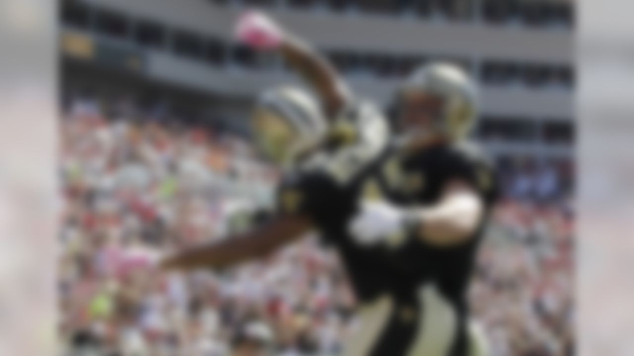 New Orleans Saints receiver Robert Meachem (17) reacts with teammate David Thomas following a first half score against the Tampa Bay Buccaneers in their NFL football game in Tampa, Fla., Sunday, Oct. 17, 2010.  (AP Photo/Chris O'Meara)