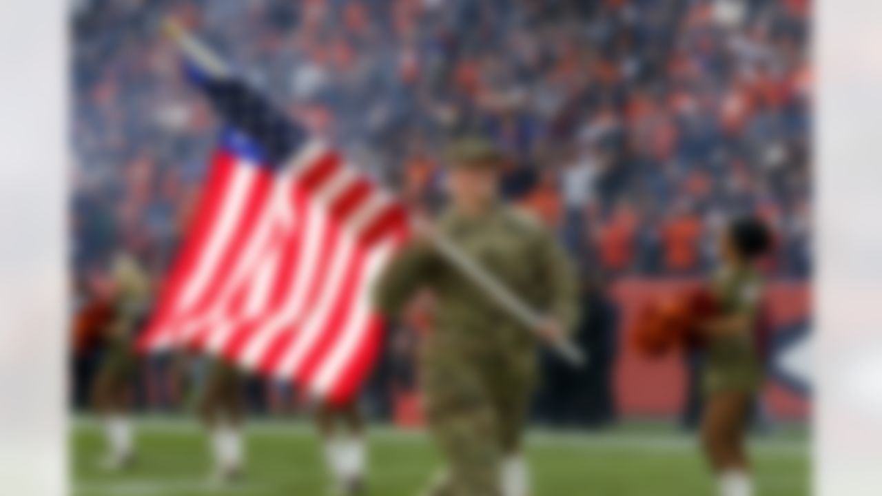 U.S. Soldiers and Airmen with the Colorado National Guard participate in the "Salute to Service" program at Empower Field at Mile High just before the Denver Broncos host the Cleveland Browns Nov. 3, 2019. All 32 National Football League teams are paying tribute to each branch of the U.S. armed forces as part of the NFL's "Salute to Service" campaign in the month of November. (U.S. Army National Guard photo by Staff Sgt. Zachary Sheely/RELEASED)