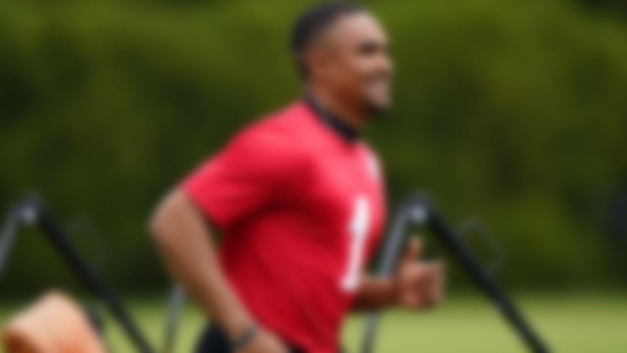 Philadelphia Eagles' Jalen Hurts runs onto the field before organized team activities at the NFL football team's training facility, Tuesday, May 25, 2021, in Philadelphia.