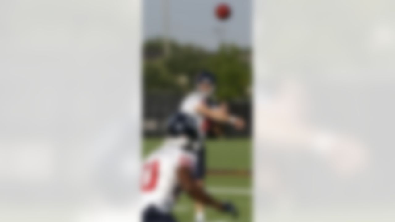 Houston Texans quarterback Matt Schaub (8) throws a pass to wide receiver Andre Johnson (80) during the team's first NFL training camp practice of the season, Friday, July 30, 2010 in Houston. (AP Photo/David J. Phillip)