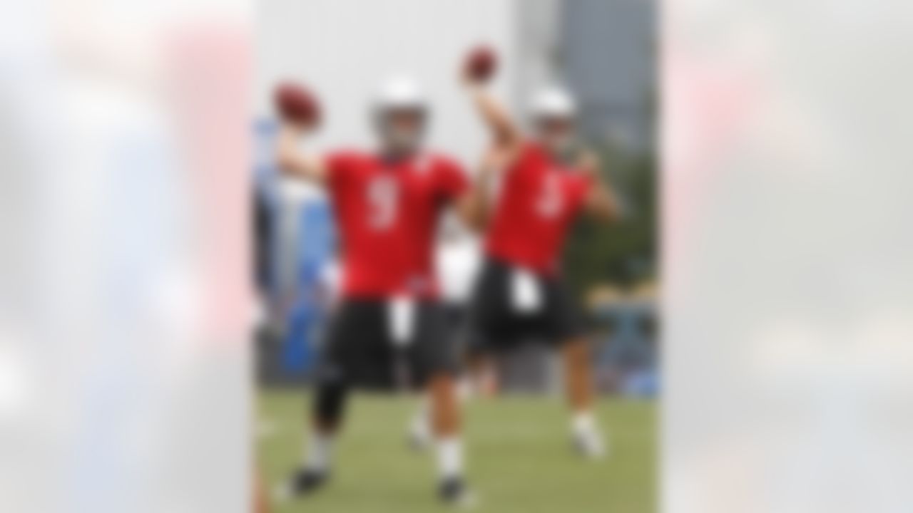 Detroit Lions quarterback Matthew Stafford (9) practices with teammate Drew Stanton (5) during football camp at their training facility in Allen Park, Mich., Monday, Aug. 2, 2010. Stafford is the undisputed starting quarterback for the Lions, unlike this time a year ago when he was competing with Daunte Culpepper for the job. (AP Photo/Carlos Osorio)