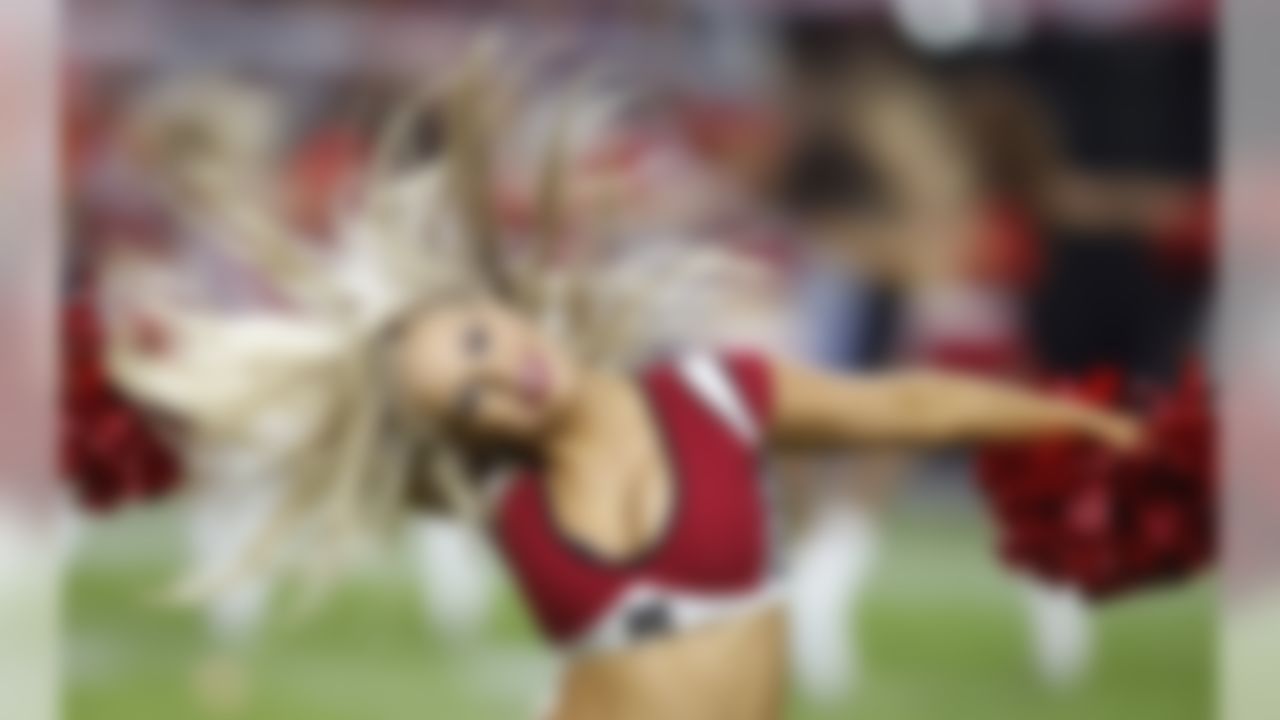 An Arizona Cardinals cheerleader performs during the second half of an NFL football game against the Kansas City Chiefs Sunday, Dec. 7, 2014, in Glendale, Ariz. (AP Photo/Ross D. Franklin)
