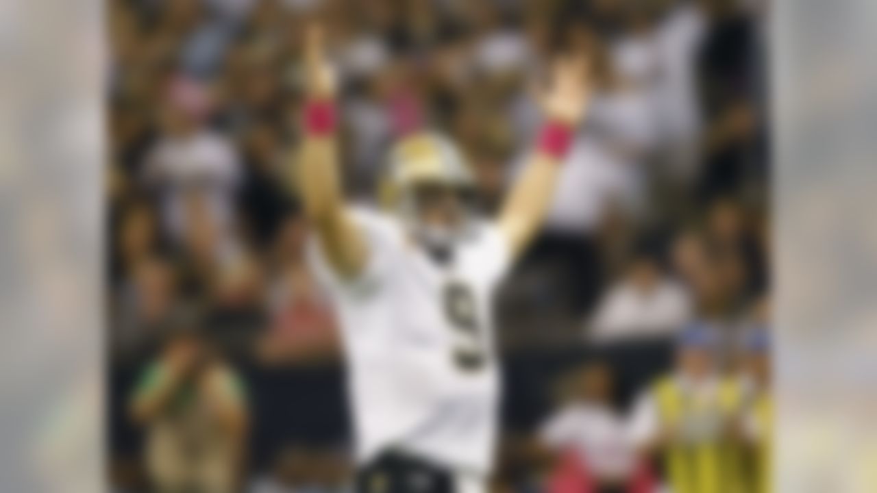 New Orleans Saints quarterback Drew Brees (9) celebrates after throwing a touchdown pass against the Indianapolis Colts at the Mercedes-Benz Superdome on October 23, 2011 in New Orleans, Louisiana. (Aaron M. Sprecher/NFL)