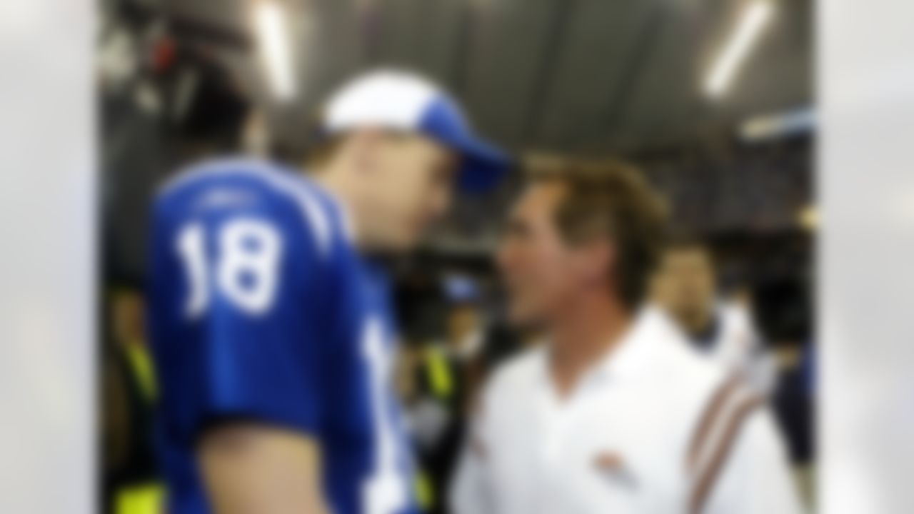 INDIANAPOLIS - JANUARY 4: Quarterback Peyton Manning #18 of the Indianapolis Colts speaks to head coach Mike Shanahan of the Denver Broncos after the Colts defeated the Broncos 41-10 in their AFC Playoff Game on January 4, 2004 at the RCA Dome in Indianapolis, Indiana. (Photo by Donald Miralle/Getty Images)
