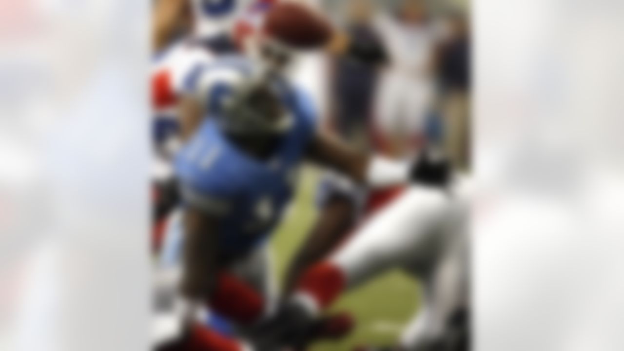 DETROIT - OCTOBER 15: Roy Williams #11 of the Detroit Lions keeps his eye on the ball after it was knocked loose but later ruled down against the Buffalo Bills on October 15, 2006 at Ford Field in Detroit, Michigan.