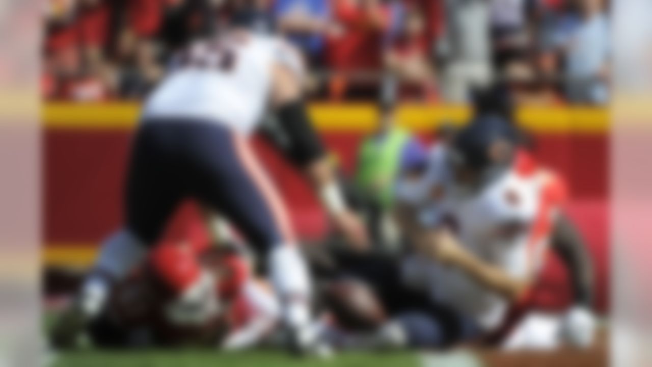 Chicago Bears quarterback Jay Cutler (6) fumbles the ball after a sack by Kansas City Chiefs defensive lineman Jaye Howard, rear right, during the first half of an NFL football game in Kansas City, Mo., Sunday, Oct. 11, 2015. The ball was recovered up by Chiefs linebacker Ramik Wilson (not shown) for a touchdown. (AP Photo/Ed Zurga)