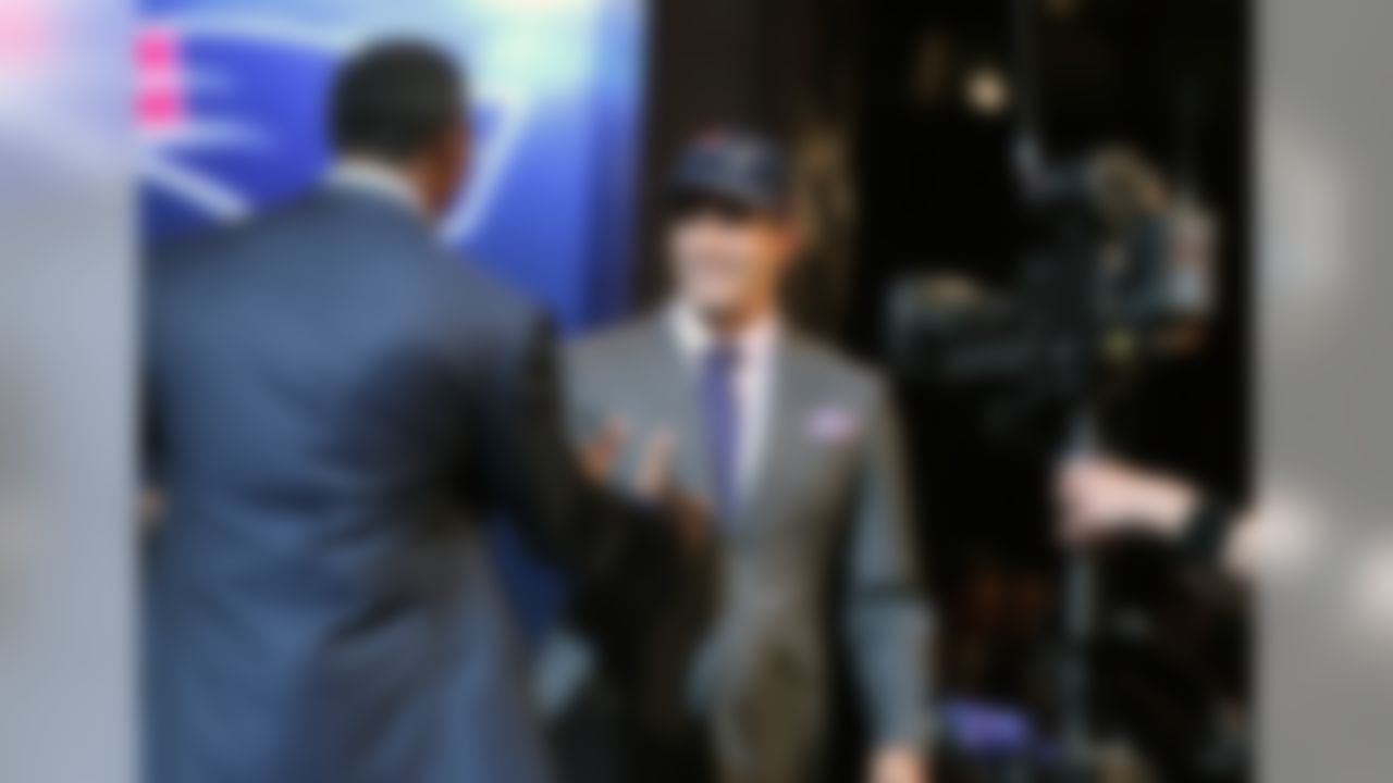 Jimmy Garoppolo greets Willie McGinest on stage after being selected by the New England Patriots during the 2014 NFL Draft at Radio City Music Hall on May 9, 2014 in New York, NY. (Perry Knotts/NFL)