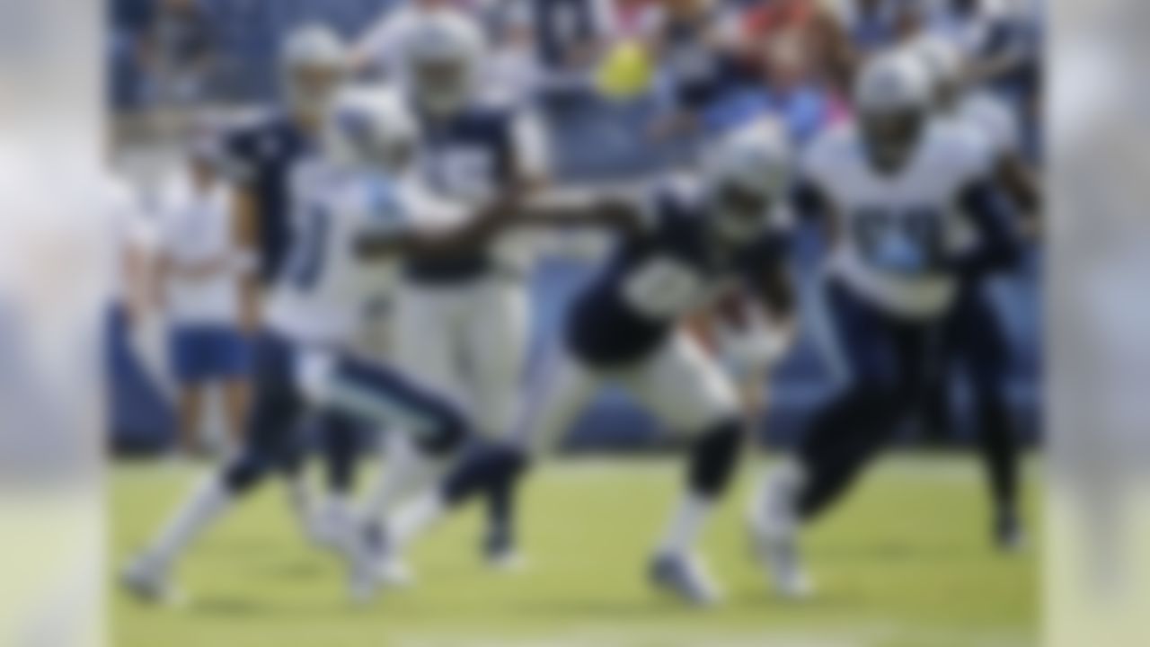 Dallas Cowboys wide receiver Dez Bryant (88) tries to get past Tennessee Titans cornerback Jason McCourty (30) in the first quarter of an NFL football game Sunday, Sept. 14, 2014, in Nashville, Tenn. (AP Photo/Wade Payne)