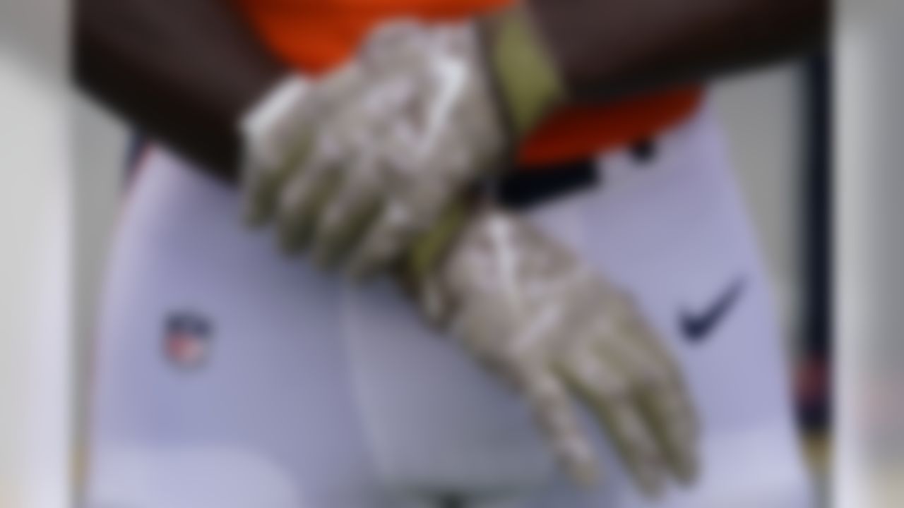 A detail view of camouflage gloves during the first half of an NFL football game between the Denver Broncos and the Cleveland Browns, Sunday, Nov. 3, 2019, in Denver.