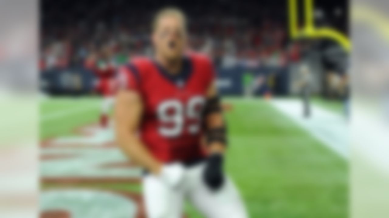 Houston Texans' J.J. Watt (99) shouts in the direction of fans from the end zone before an NFL football game against the New England Patriots on Sunday,  Dec. 13, 2015, in Houston. (AP Photo/George Bridges)