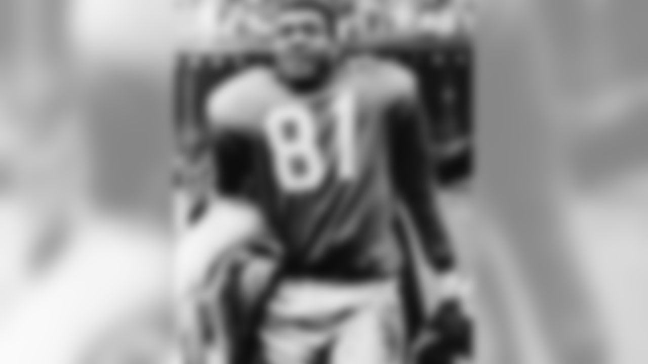 Dick Lane of the Detroit Lions leaves the field at Briggs Stadium after intercepting a Johnny Unitas pass in closing minutes of game and racing 80 yards for and insurance touchdown, Oct. 23, 1960, Detroit, Mich. Detroit upset the Baltimore Colts 30-17. (AP Photo/Preston Stroup)