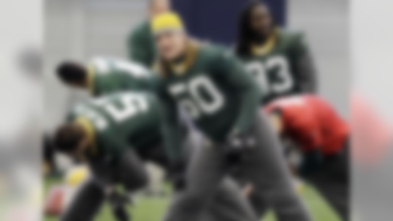 Green Bay Packers' A.J. Hawk (50) stretches with teammates during practice, Thursday, Feb. 3, 2011, in Dallas. Green Bay will face the Pittsburgh Steelers in the NFL football Super Bowl XLV Sunday. (AP Photo/Eric Gay)